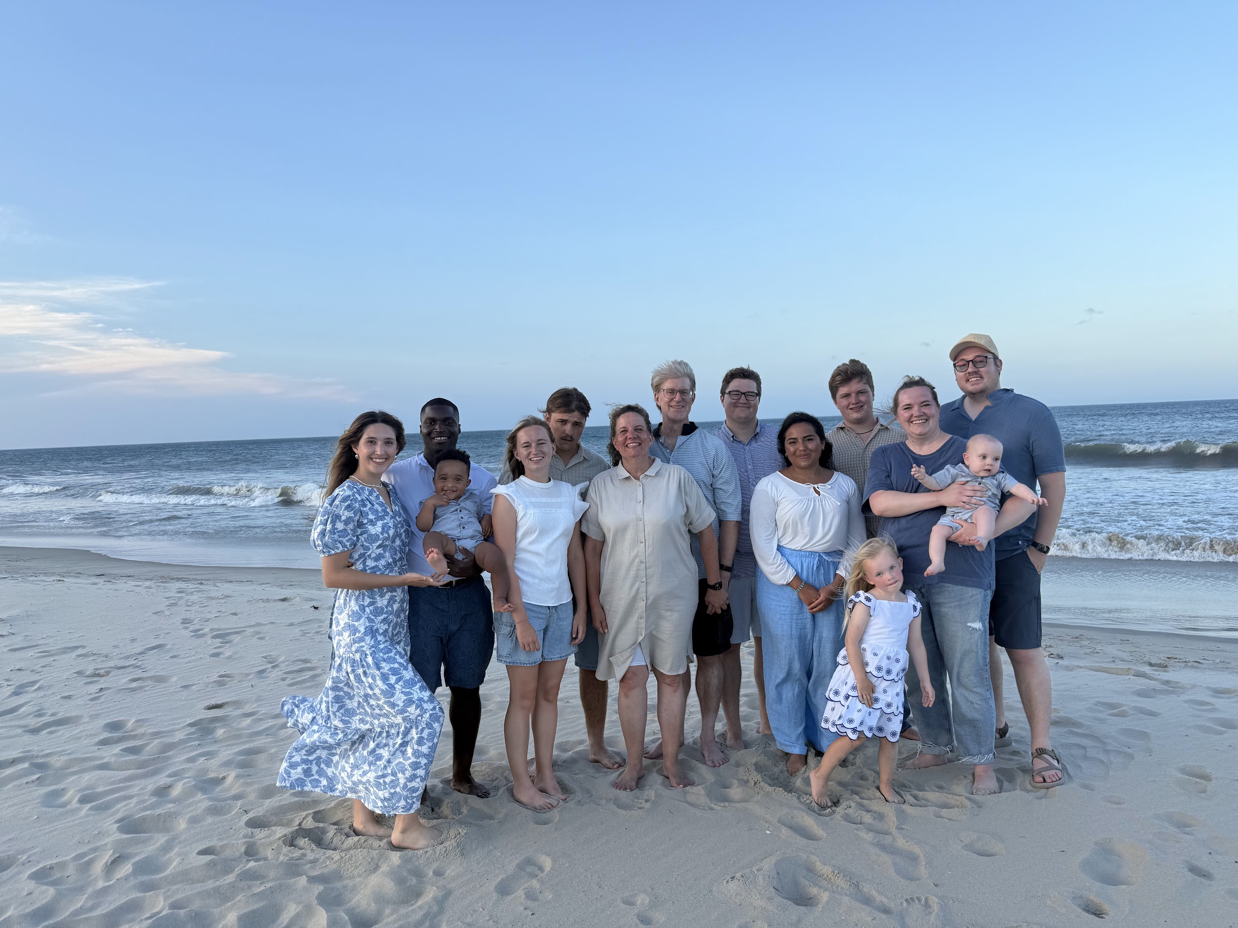 Family portrait near the ocean with open sky